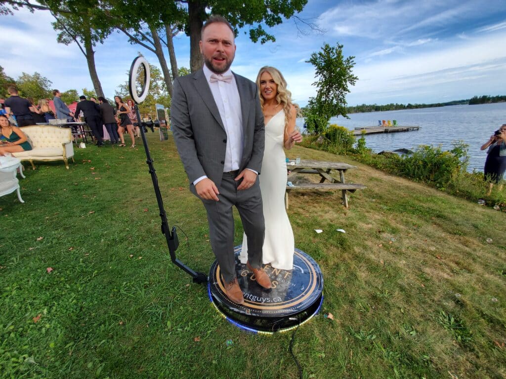 Bride and groom enjoying the 360 photo booth