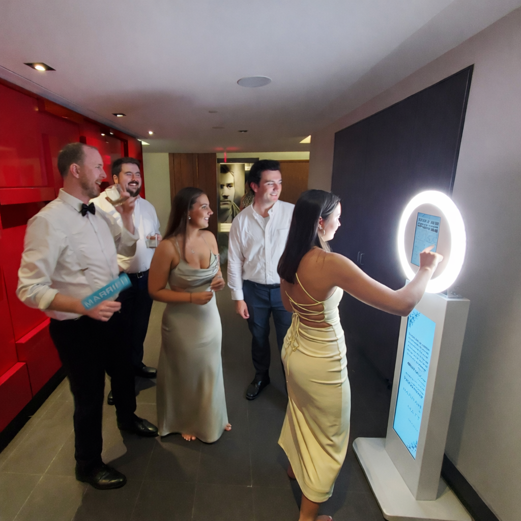 Guests using iPad Tower photo booth