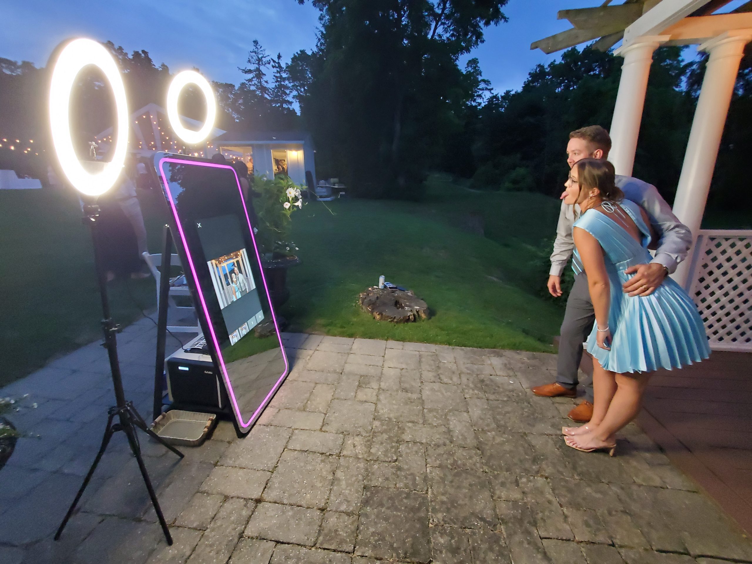 Guests enjoying a Magic Mirror photo booth at a Peterborough wedding