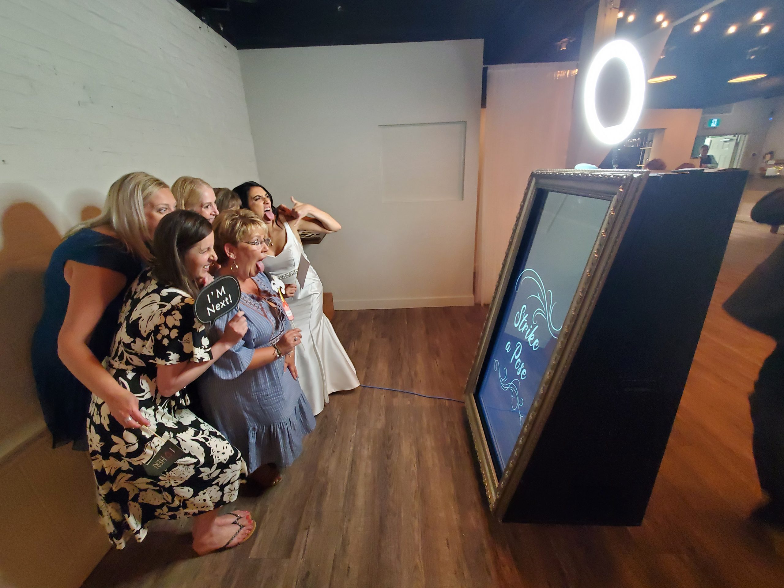 Wedding guests enjoying interactive photo booth entertainment