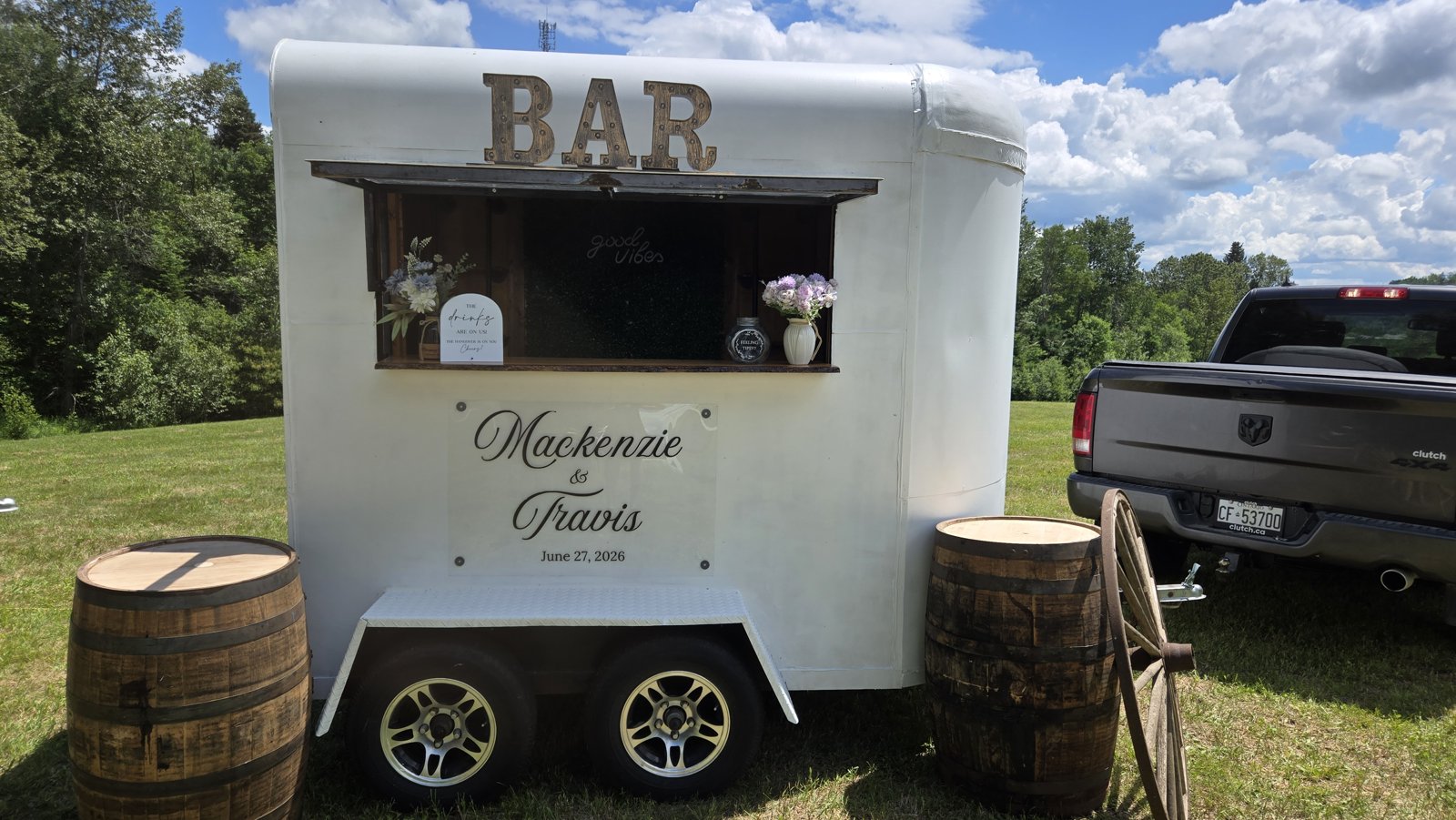 Travelling Spirits vintage trailer bar serving guests at a wedding in Whitby, Ontario
